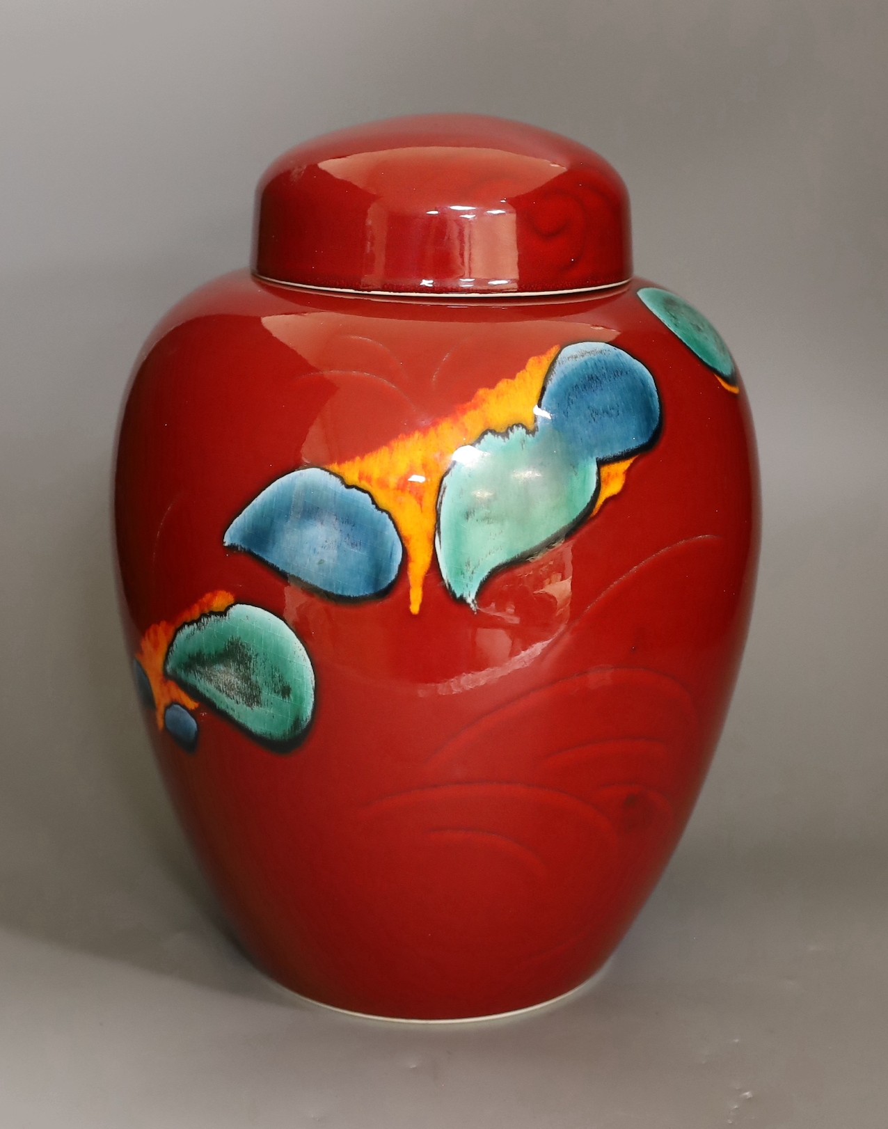 A large Poole Volcano design jar and cover, 32cm high